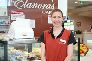 Lady standing in front of cafe