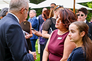 Prime Minister Anthony Albanese with Dr Daniela Vecchio at the Australian of the Year awards. Dr Vecchio's daughter stands beside her.