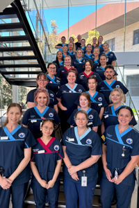 RGH nursing and midwifery graduates standing all together on a staircase.