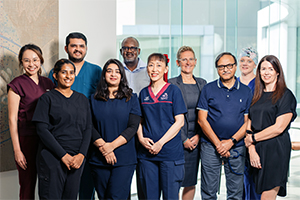 A group of men and women who are part of the Rockingham General Hospital Workplace Based Assessment program stand teogther