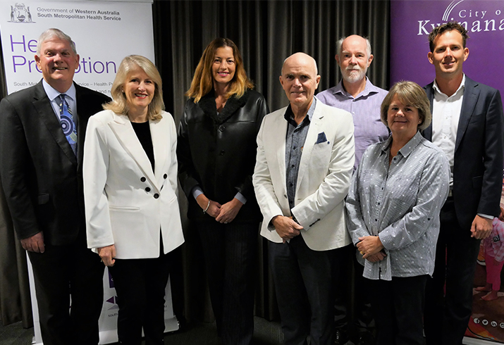 Four men and three women standing together