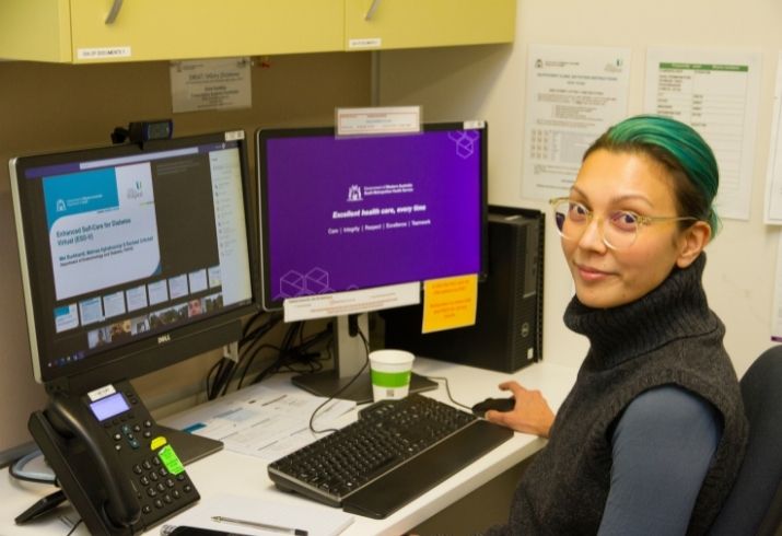 Staff member talking to patients through Teams online meeting.