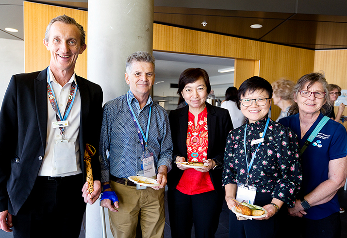 A group of five people standing together